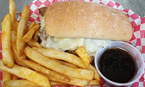 Prime Rib Sandwich with French Fries and cup of Au Jus